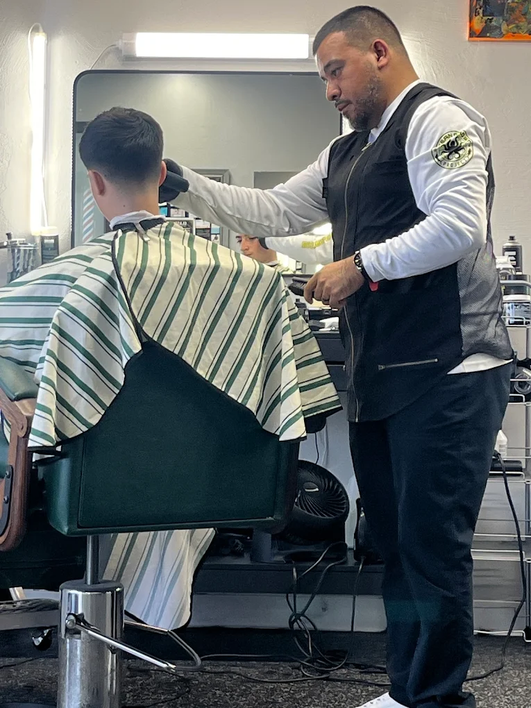Barber at work cutting a client's hair