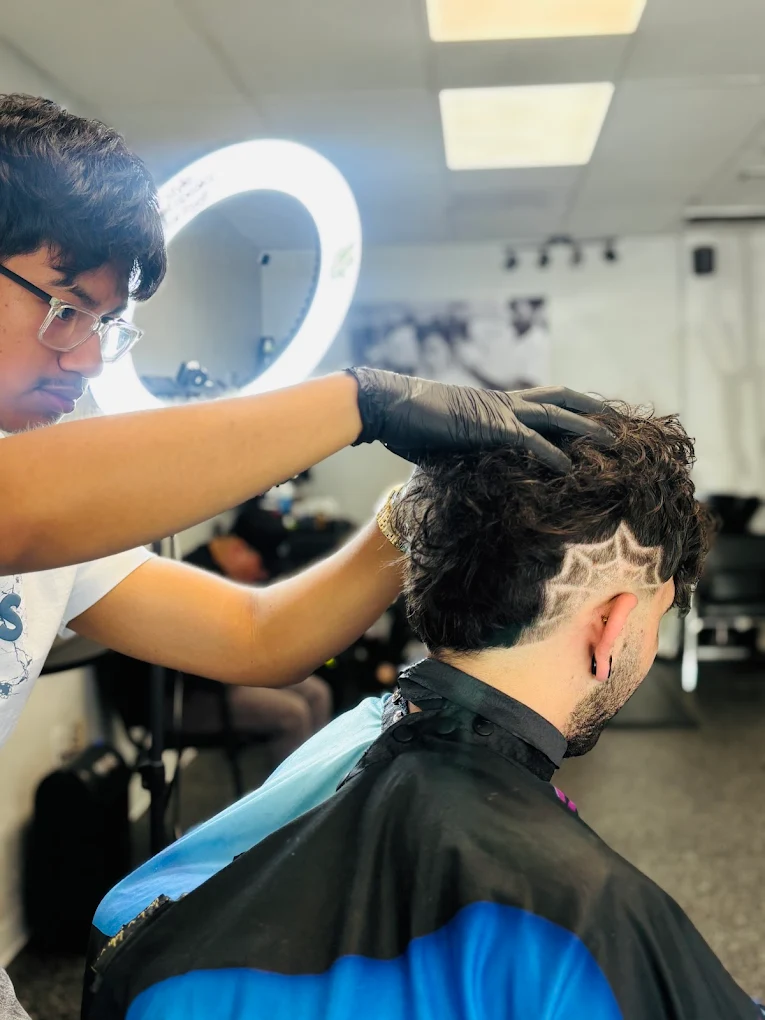 Freestyle design shaved into a client's hair