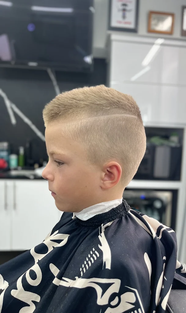 Boy's haircut with a hard-part design