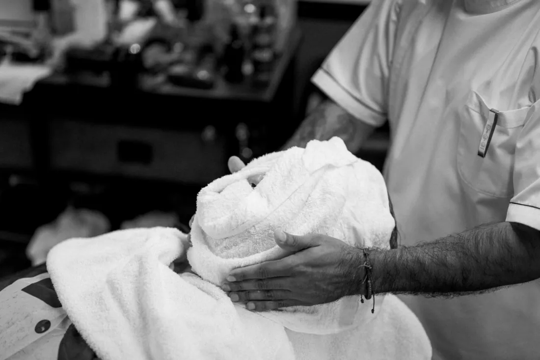 Hot towel wrapped on before a shave