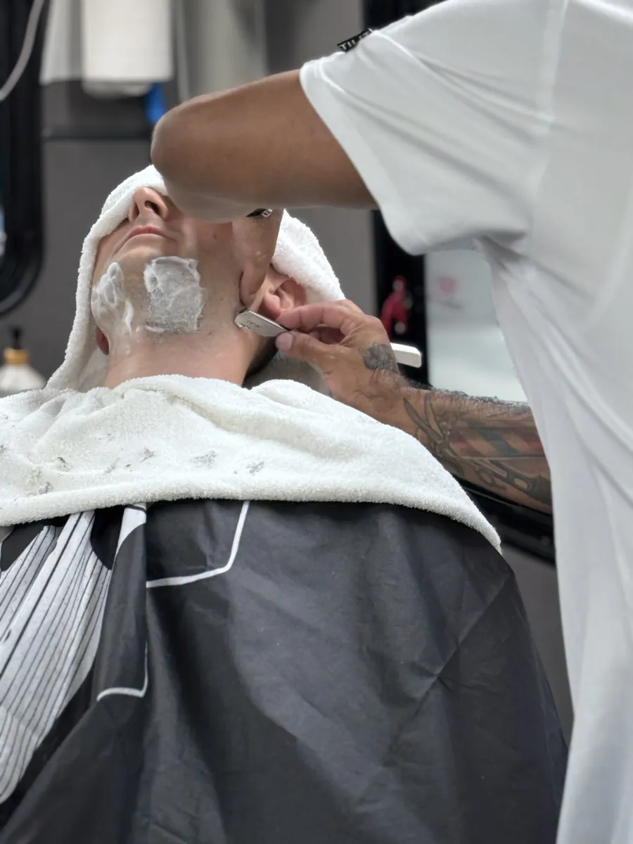 Warm lather brushed on before the razor